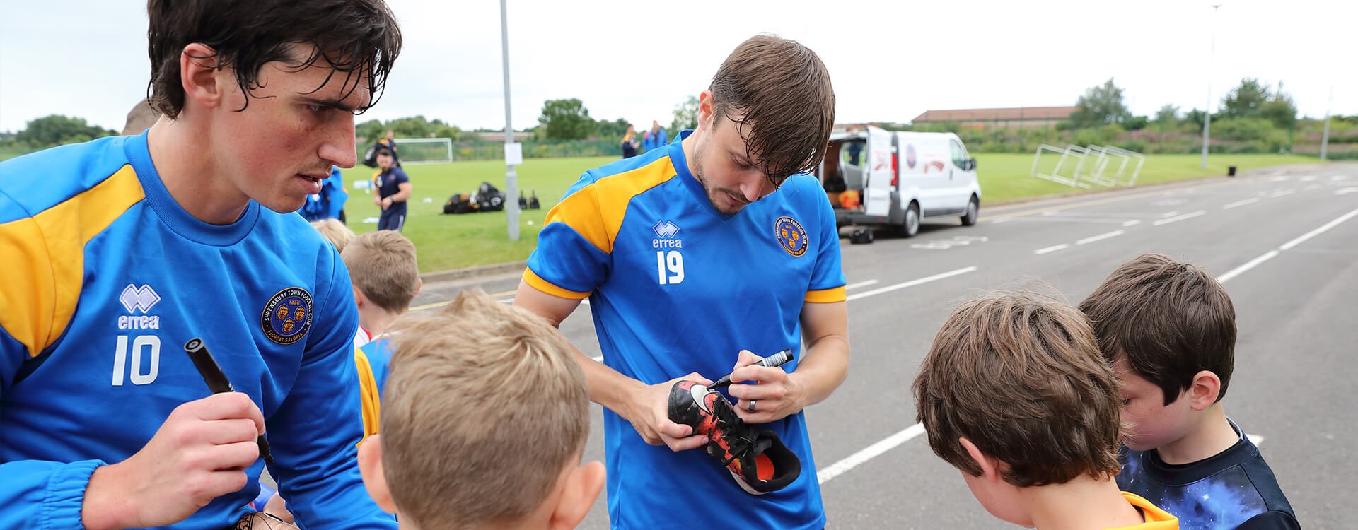 Shrewsbury Town FC players sign boots for fans