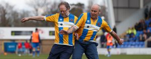 Walking footballers compete on the pitch