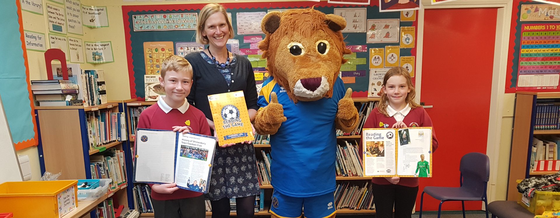 Lenny the Lion celebrates reading the game
