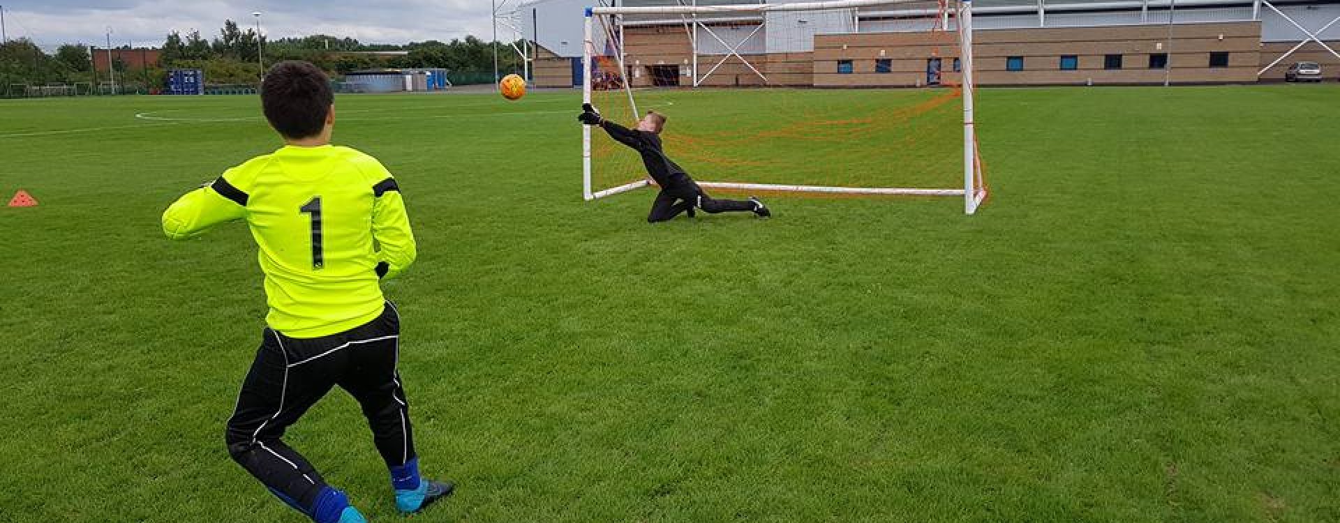 Goalkeeper making a save on the Community Pitch